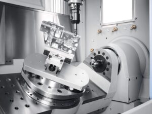 3+2 indexed CNC machining with rotary axes positioning the workpiece at a fixed cutting angle